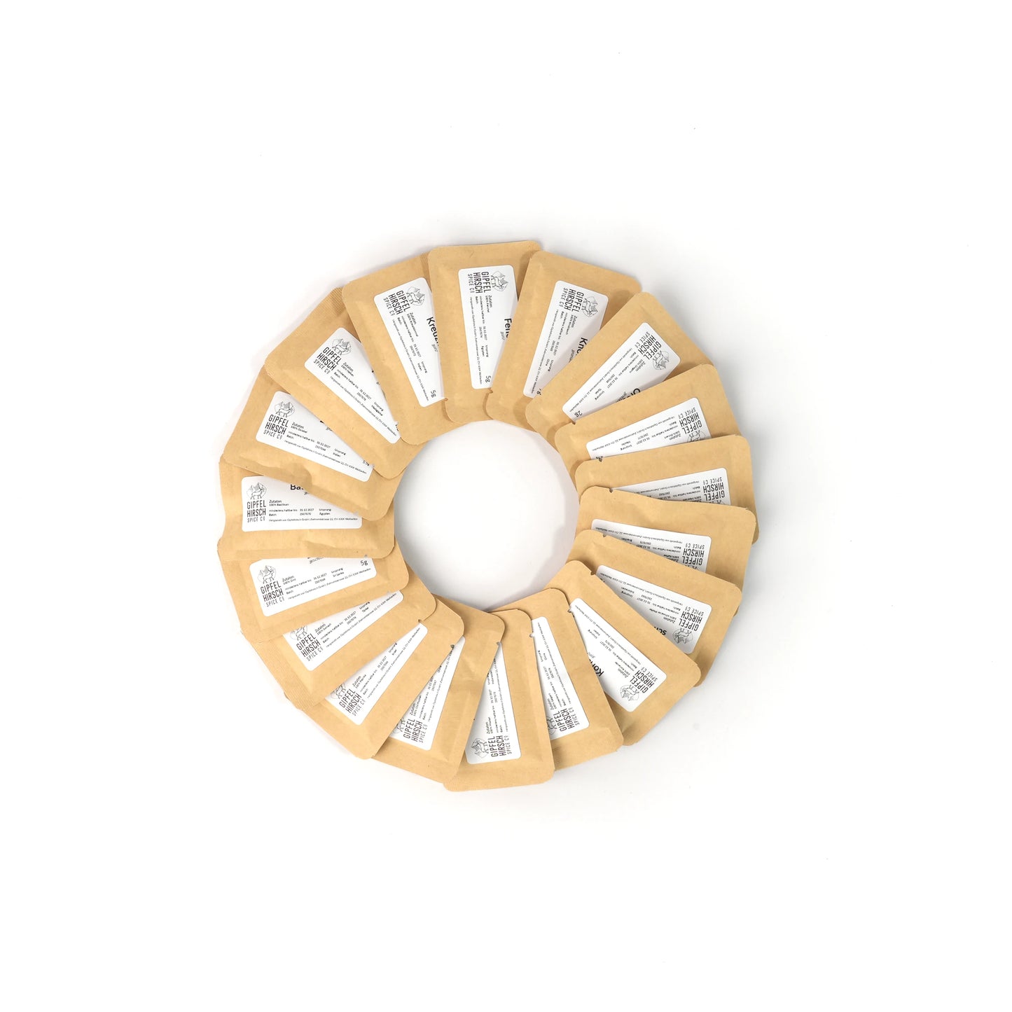 Circular arrangement of 18 small packets with labels on a white background