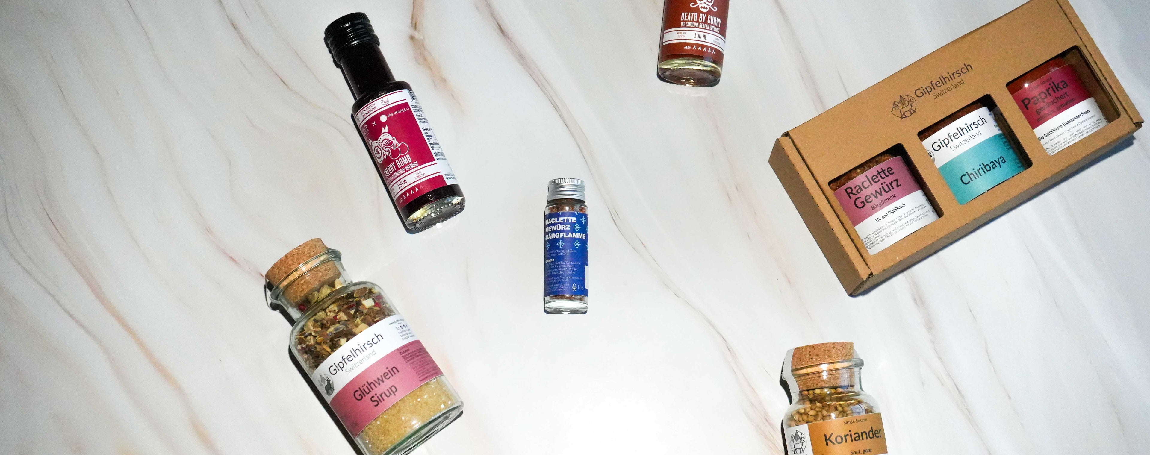 A Flatlay of Gipfelhirsch products, some of which have been customised with a new label design.
