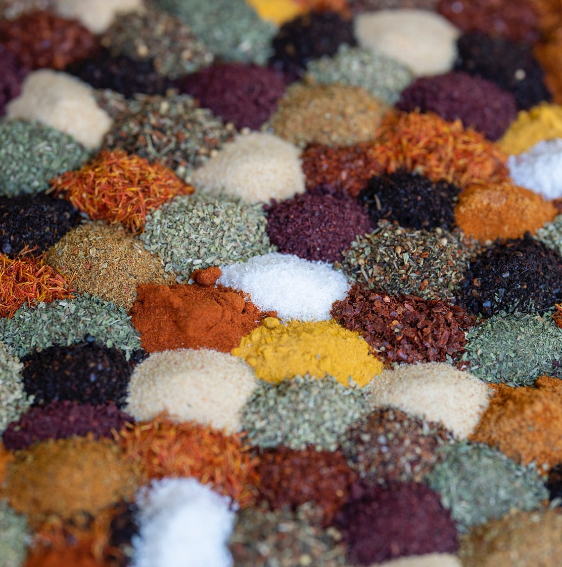 many small mounds of spices